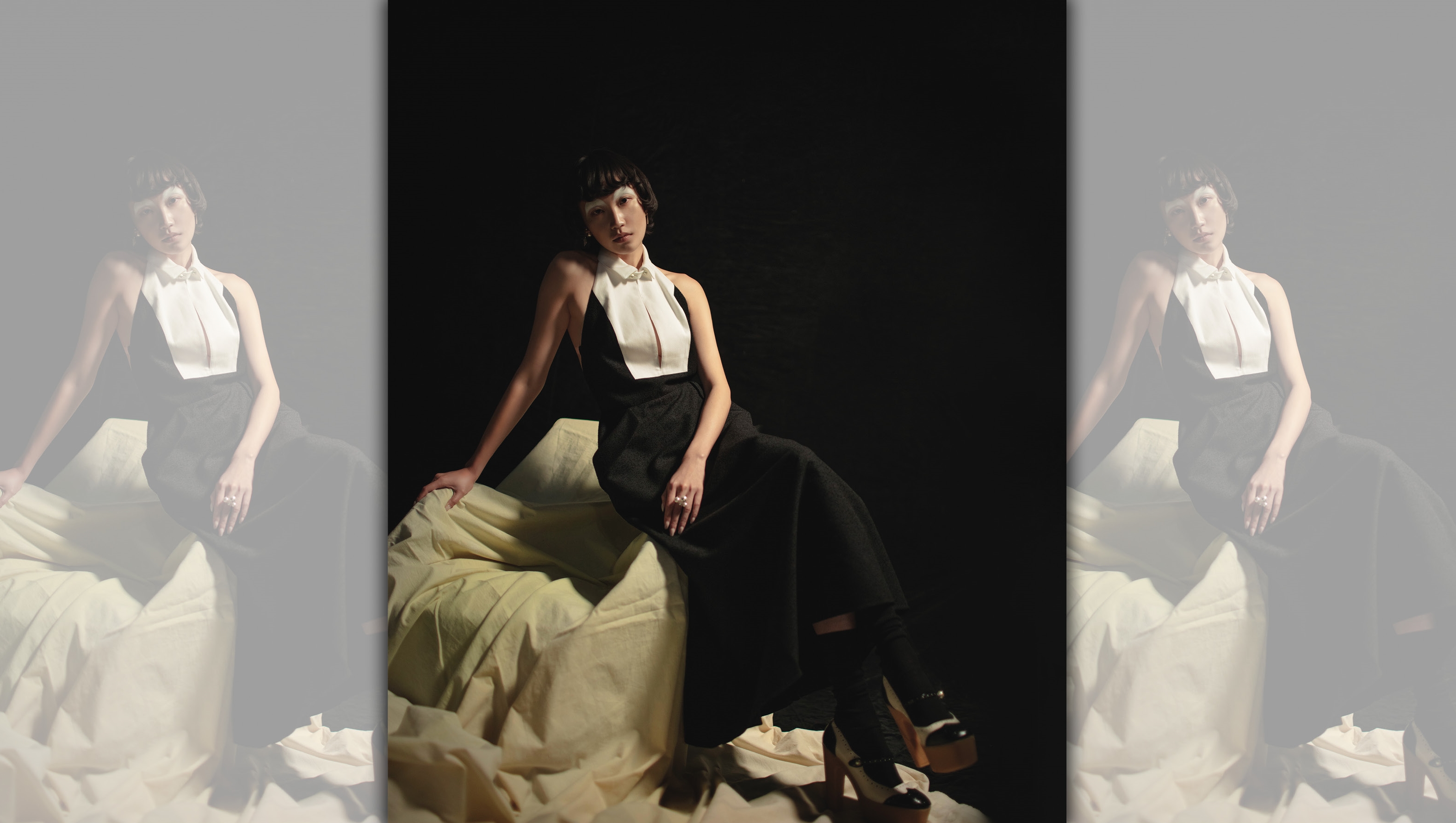 白色襯衫領長洋裝 NT$210,000 by Dior；黑色襪子 NT$16,000 by Dior；黑白拼色高跟鞋 NT$43,000 by Dior；珍珠星星耳環 NT$27,500 by Dior；珍珠戒指 價格店洽 by VERSACE。