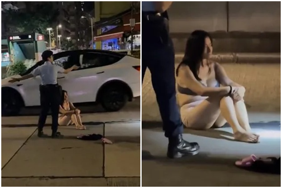 一名長髮外型亮麗的女子，不明原因，竟在車水馬龍的大馬路上，脫到只剩內衣褲。（翻攝自TikTok）