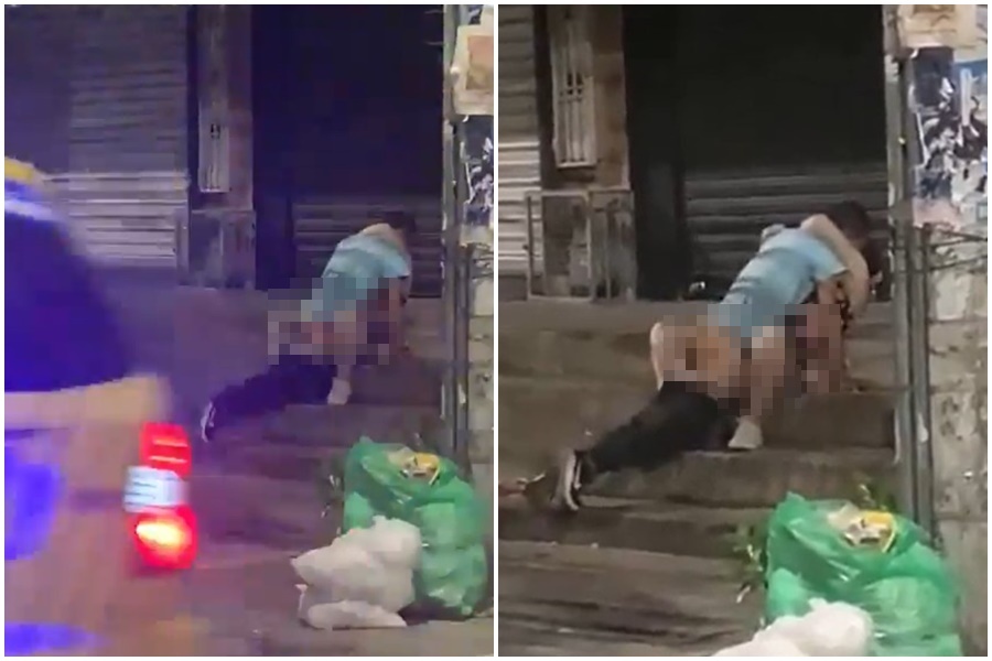 哥倫比亞一對男女在馬路邊人行道忘情連結，讓當地居民傻眼。（翻攝自X平台）