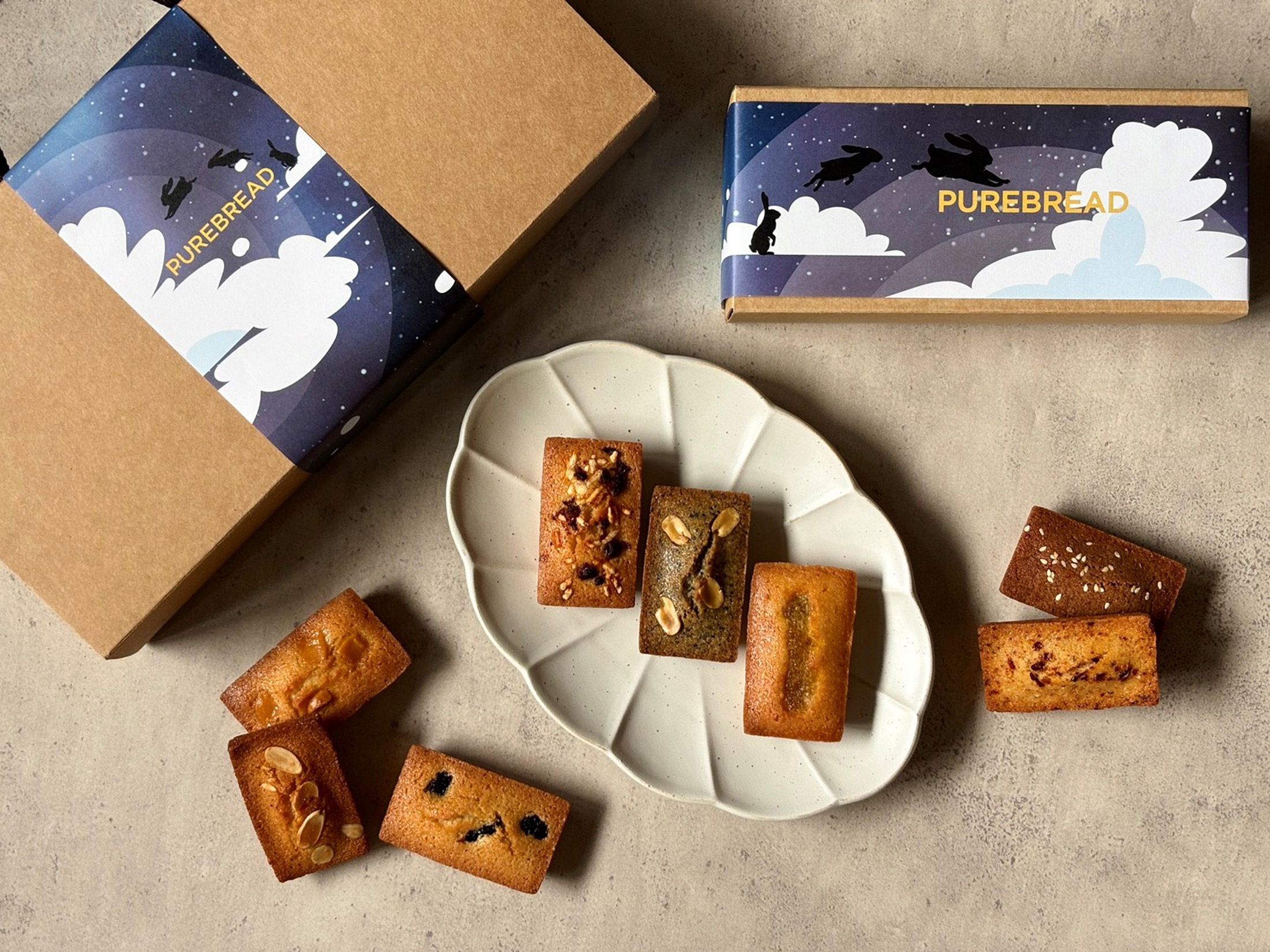 PUREBREAD Bakery推出的「中秋限定法式費南雪禮盒」，包含原味、鹹蛋黃、文旦等八款口味。（520元／8入）（PUREBREAD Bakery提供）