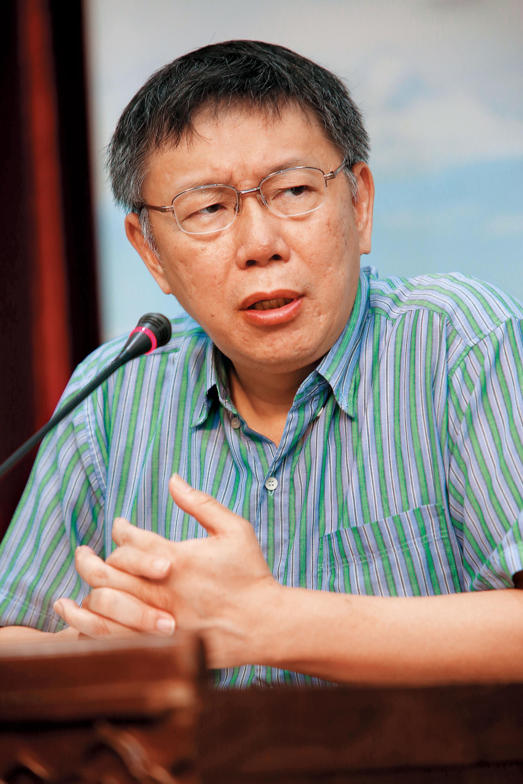 台北市長柯文哲(圖)極欲拉攏張榮味,導致北市府在農產公司人事案無法定案。
