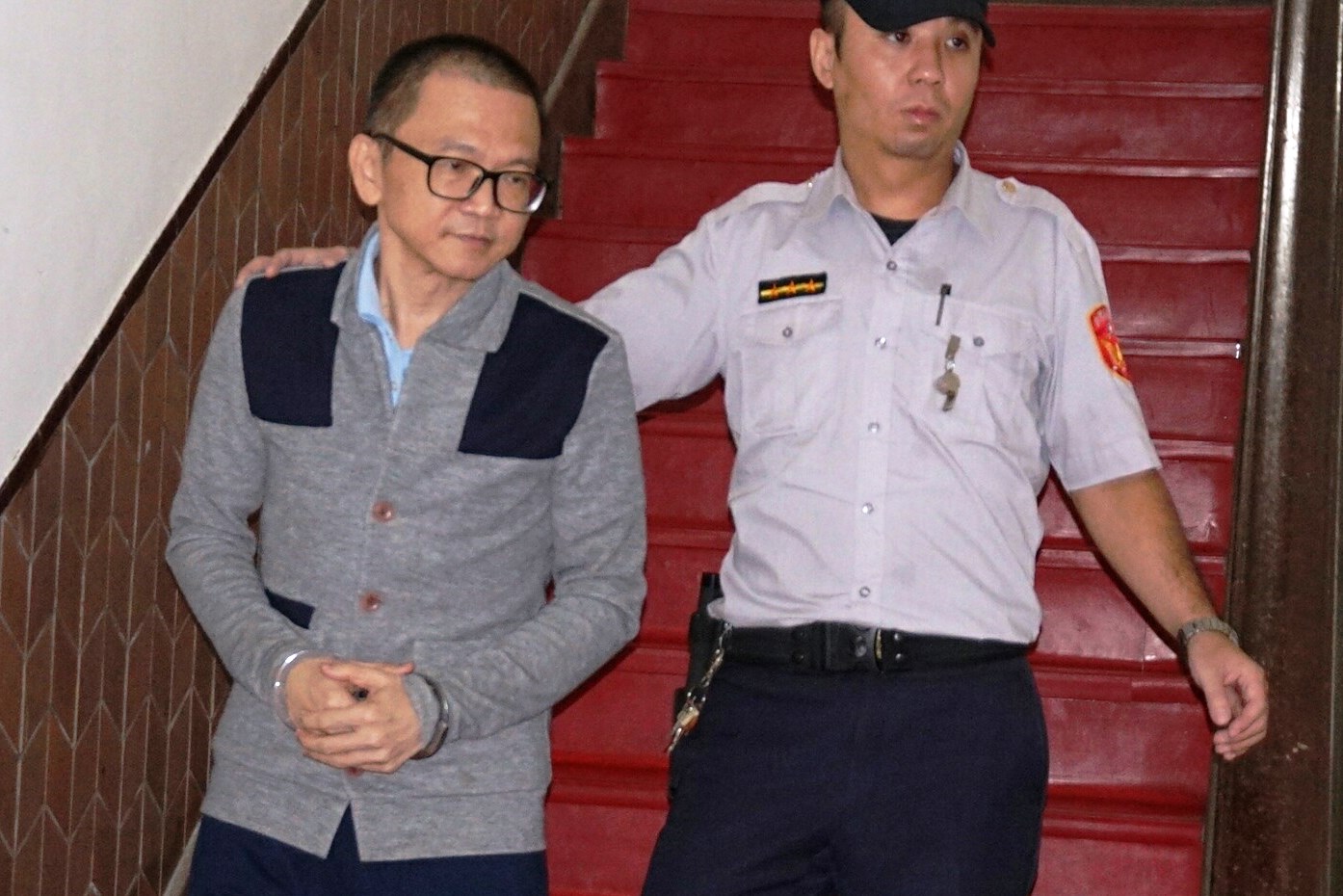 中信金集團老臣、中信金控前財務長張明田（左），因涉及中信金集團內湖購地弊案，遭押1年多後獲1億元交保。