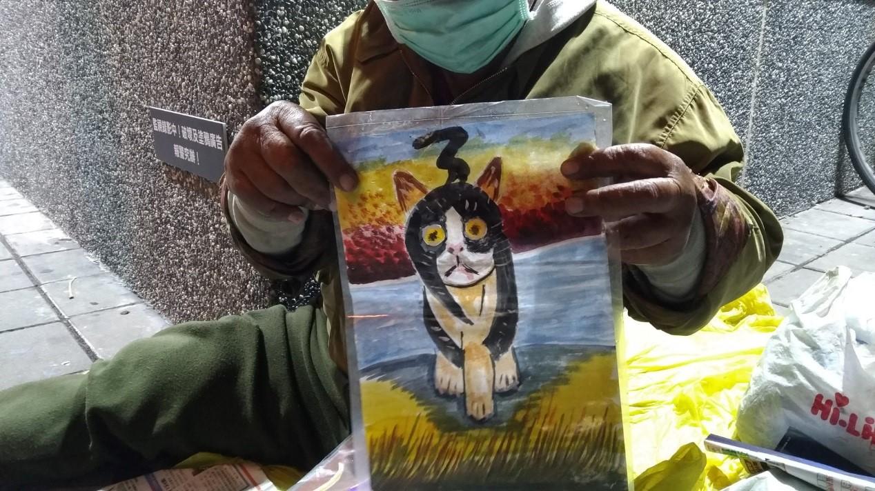街友阿伯畫的黑貓圖。(時代力量三民區議員參選人林于凱提供)