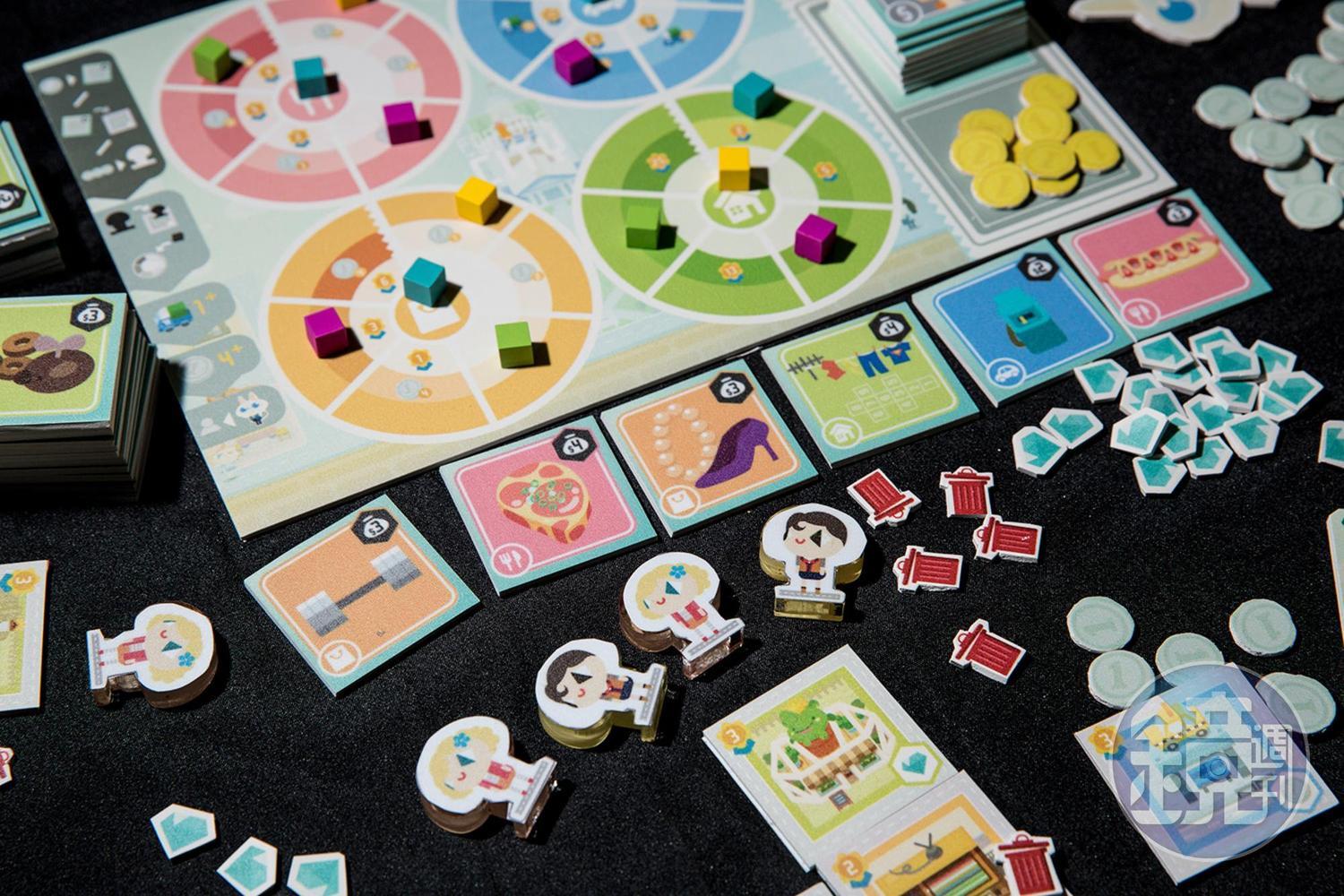 遊戲板塊有兩面,一面是消費商品,另一面是可以轉換的建築。