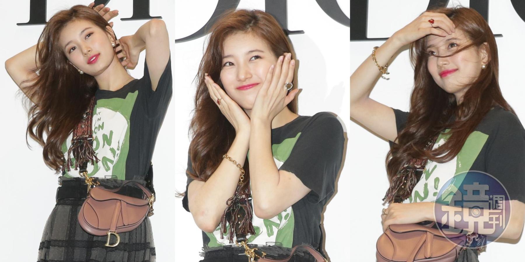 秀智身穿Dior T-Shirt,NT$25,000、灰色蕾絲格紋褶裙NT$210,000、黑色內襯褲NT$32,000、J’adior羊毛格紋高跟鞋NT$31,000、Saddle玫瑰粉色包款NT$82,000。