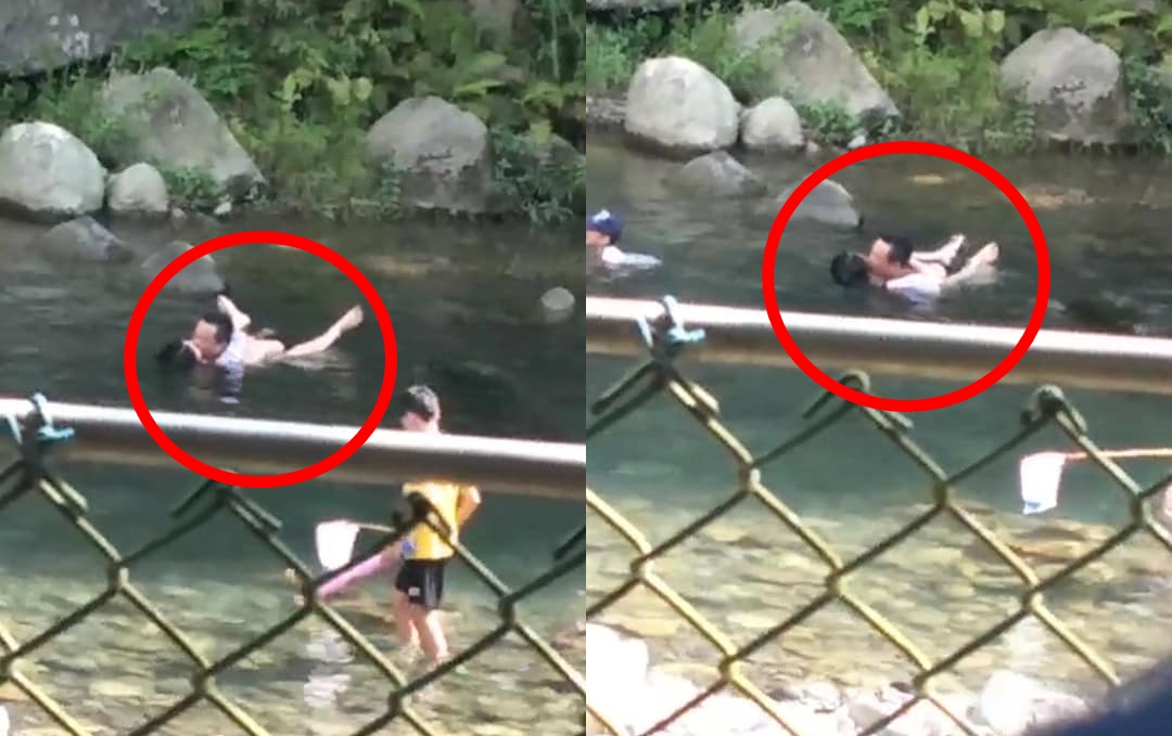 大人當眾親熱，一旁男童幾乎看傻眼。（翻攝畫面）