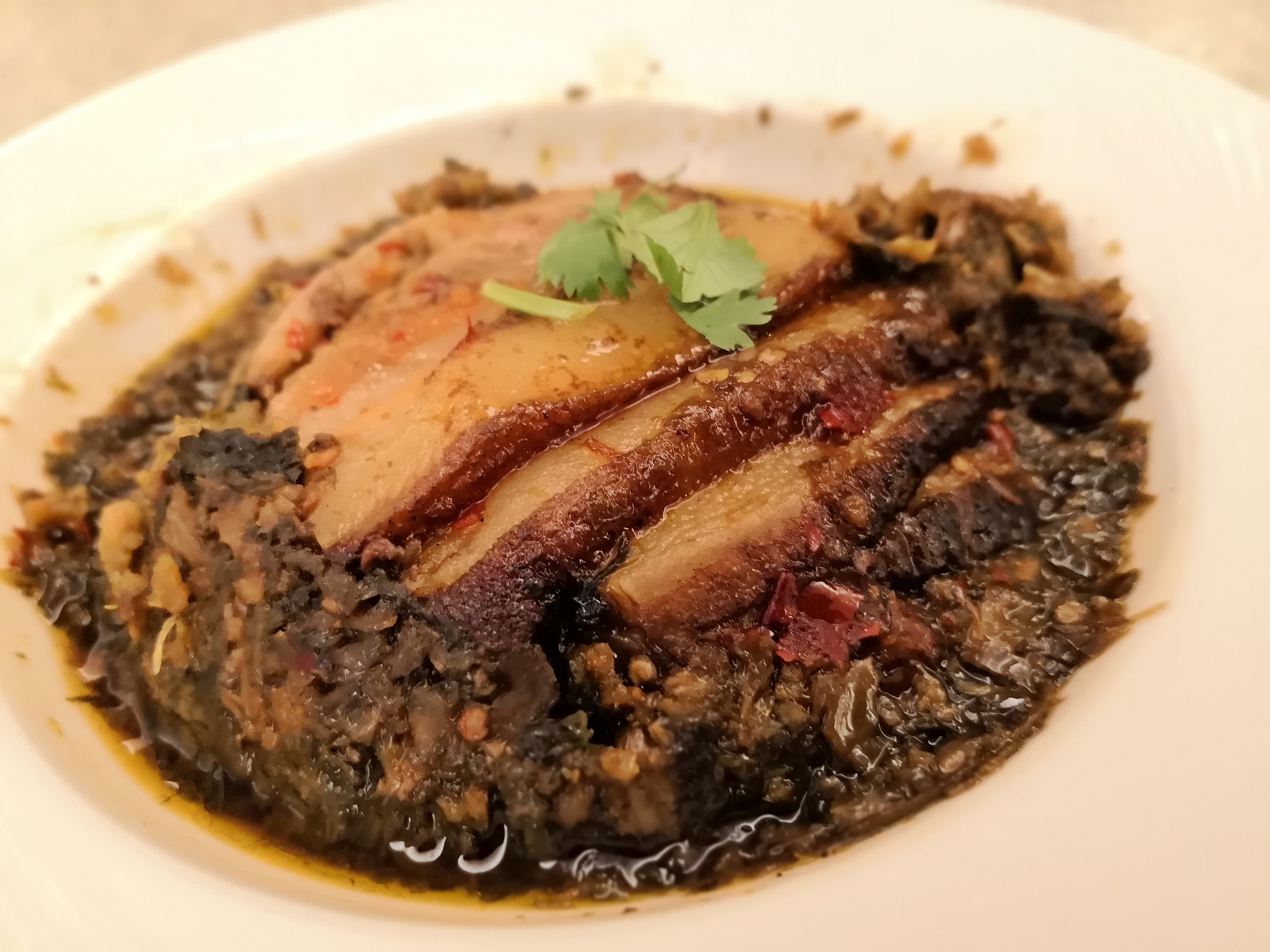 「福菜扣肉」是錦水的招牌料理。