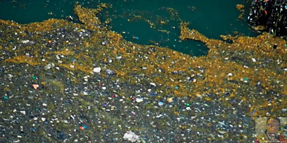八里汙水處理廠排出惡臭混濁的汙水,讓台北港變成陰陽海。(讀者提供)