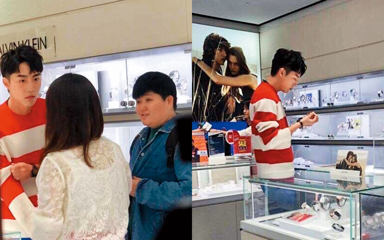 12/23 蔡凡熙專注詢問店員及工作人員手錶各款式功能特色，還在活動結束後跑去專櫃挑選手錶。（讀者提供）