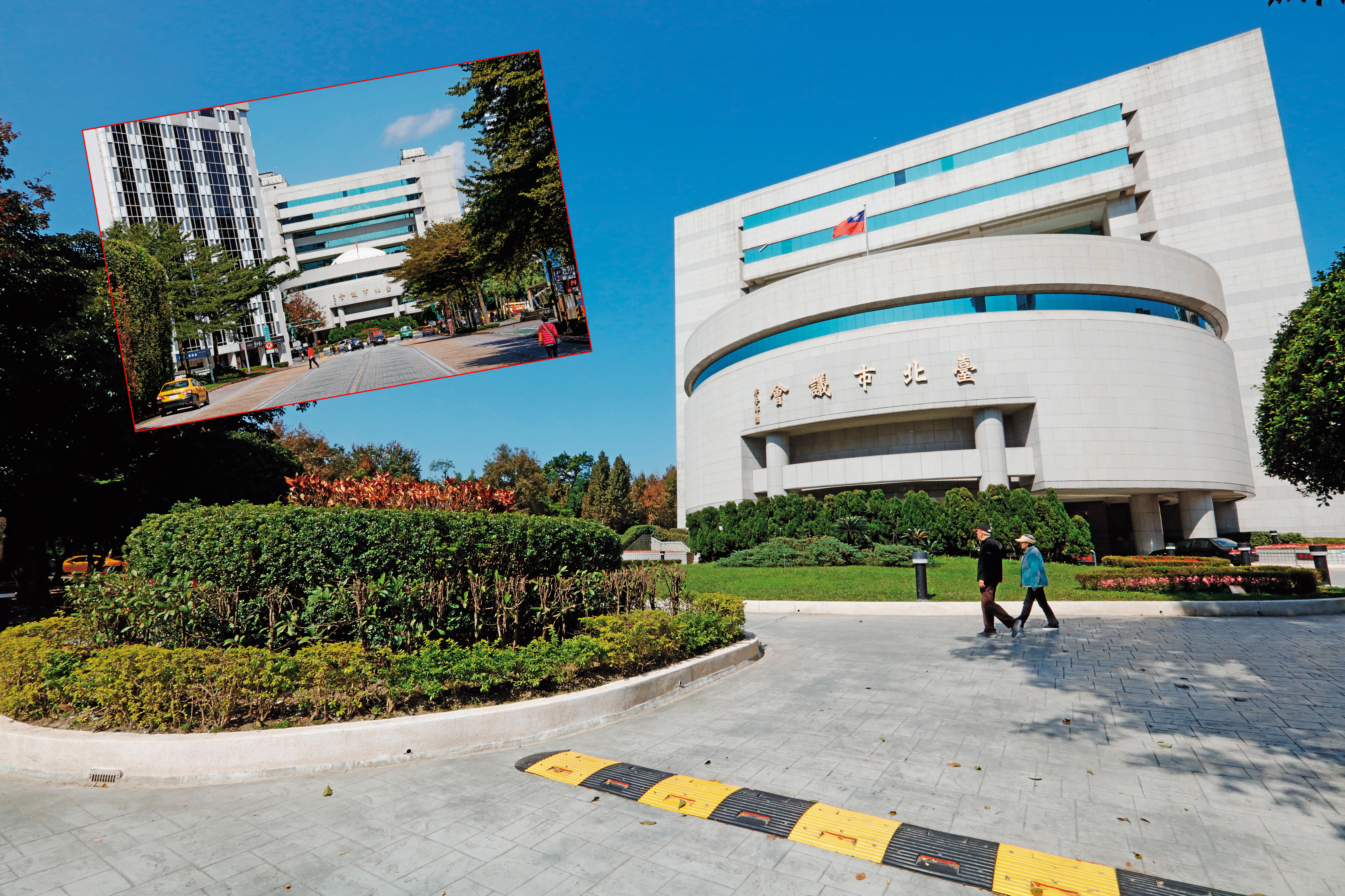 市議會正對著基隆路4線道，形成風水學上的「路衝」，議會長年在大門前以植栽擋煞。