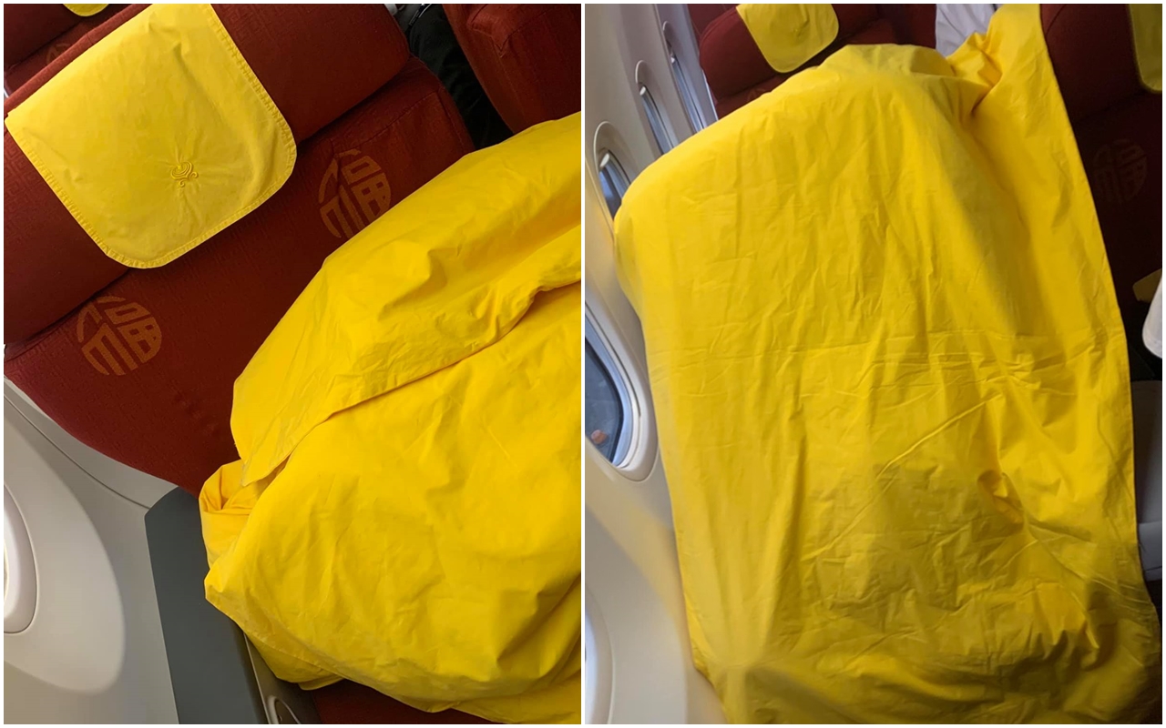 有名女網友搭乘商務艙遭遇「往生體驗」，讓她崩潰在《爆料公社》po文，直呼飛機上「棉被顏色真的要慎選」。（翻攝自爆料公社）