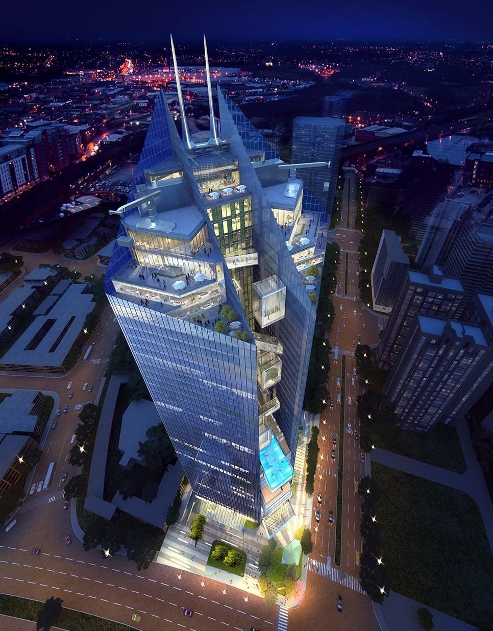 台中銀總部外牆用水晶打造晶瑩剔透的造型,配合聚寶盆珠光閃耀的寶石意象,整體造價也因此飆高。(翻攝義力營造官網)