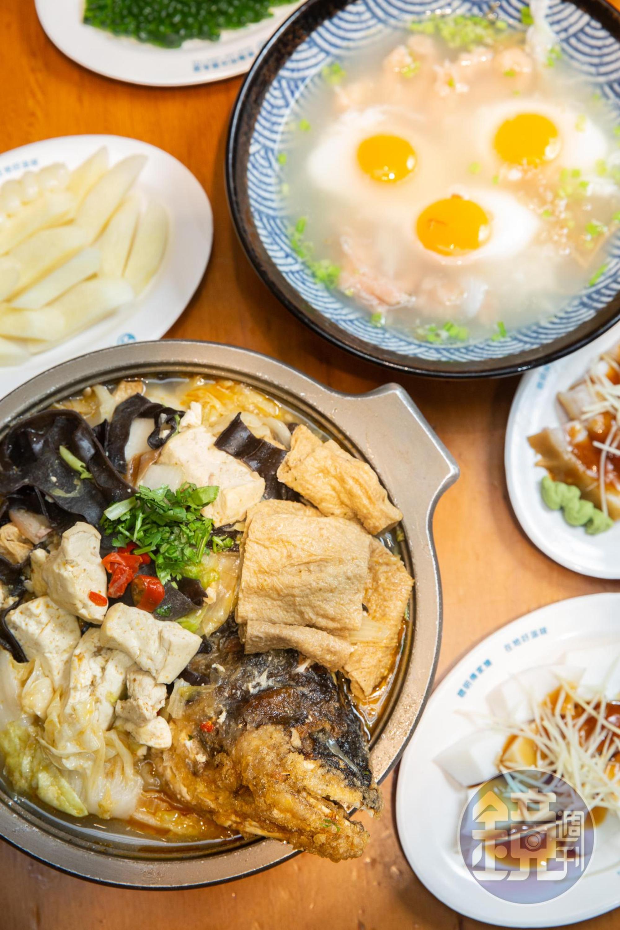 林聰明的招牌料理砂鍋魚頭(前排),是江中琇的最愛。(490元/鍋)