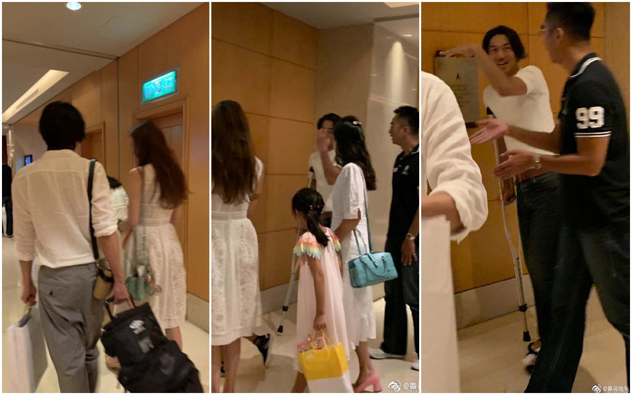 林志玲（背對鏡頭者）和哥哥林志鴻（黑衣者）及Akira（拄拐杖）在飯店被粉絲巧遇。（翻攝自微博）