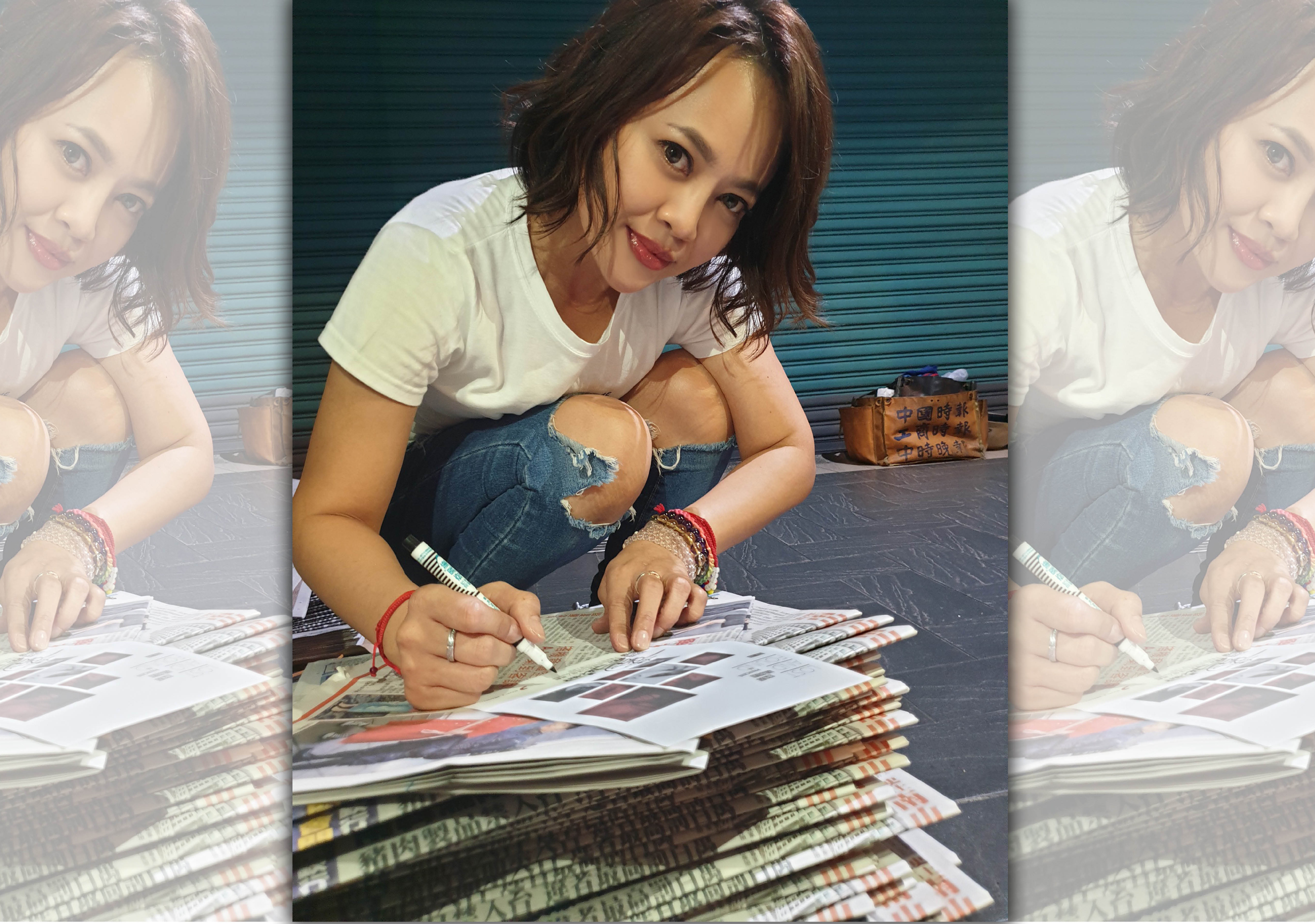 今晨戴愛玲蹲在台北街頭辛苦夾報，不到半小時就開始飆汗。（索尼音樂提供）