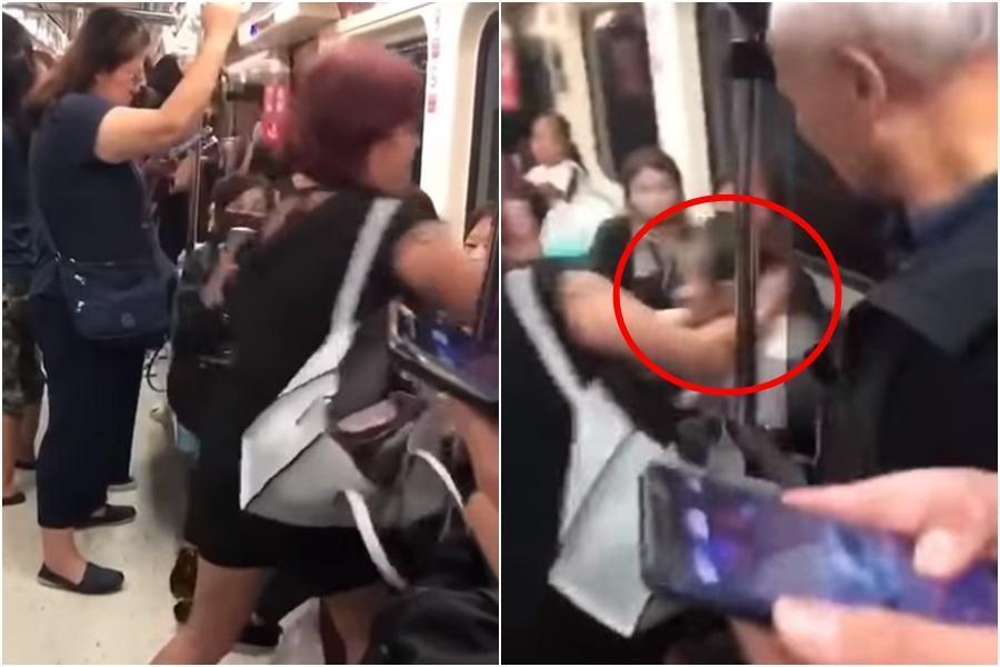 黑衣女子強扯金髮女子頭髮並拉她離開博愛座，行徑相當誇張。（翻攝自爆料公社）