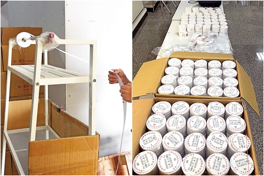 詐領集團成員將空白發票裝在層架上，拉出中獎號碼，再開立不實金額兌獎。（翻攝畫面）