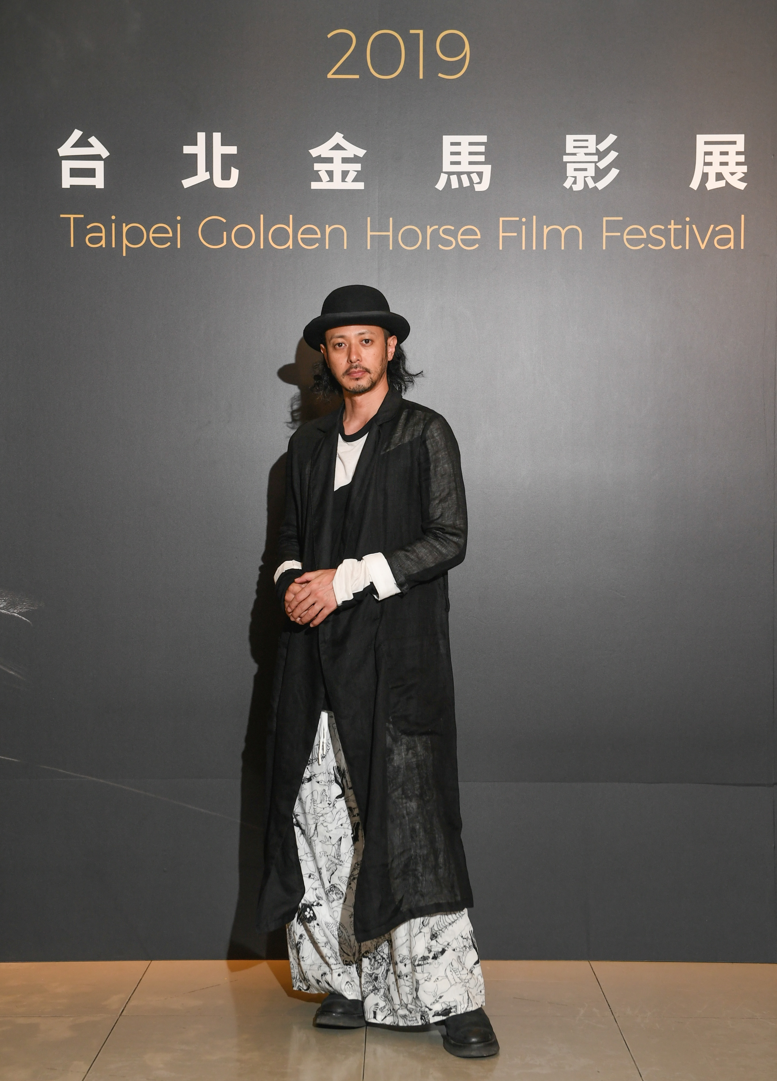 小田切讓每次現身造型都充滿個人風格。（金馬執委會提供）