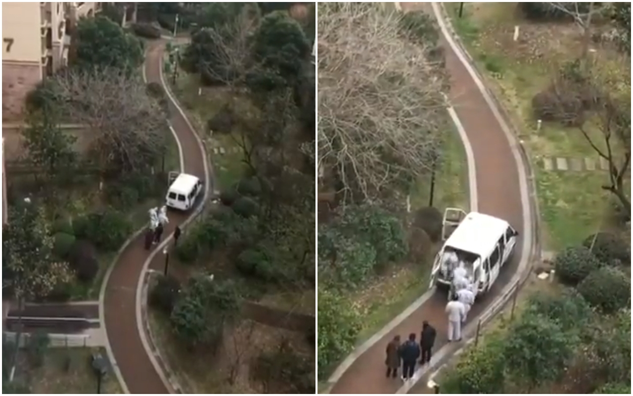 近日中國流出一段37秒影片中，有名孩子看到身穿防護衣的人員將遺體陸續抬出，讓他嚇傻驚呼「媽媽，裡面好多屍體。」（翻攝自推特）