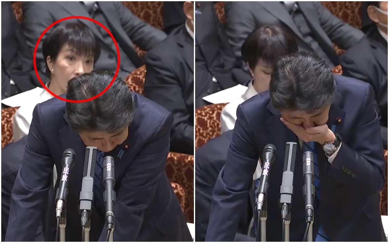 安倍晉三昨日接受質詢時，突然連續咳嗽，後方女官員（紅圈處）當場嚇傻，露出相當驚恐的表情。（翻攝自日本參議院）