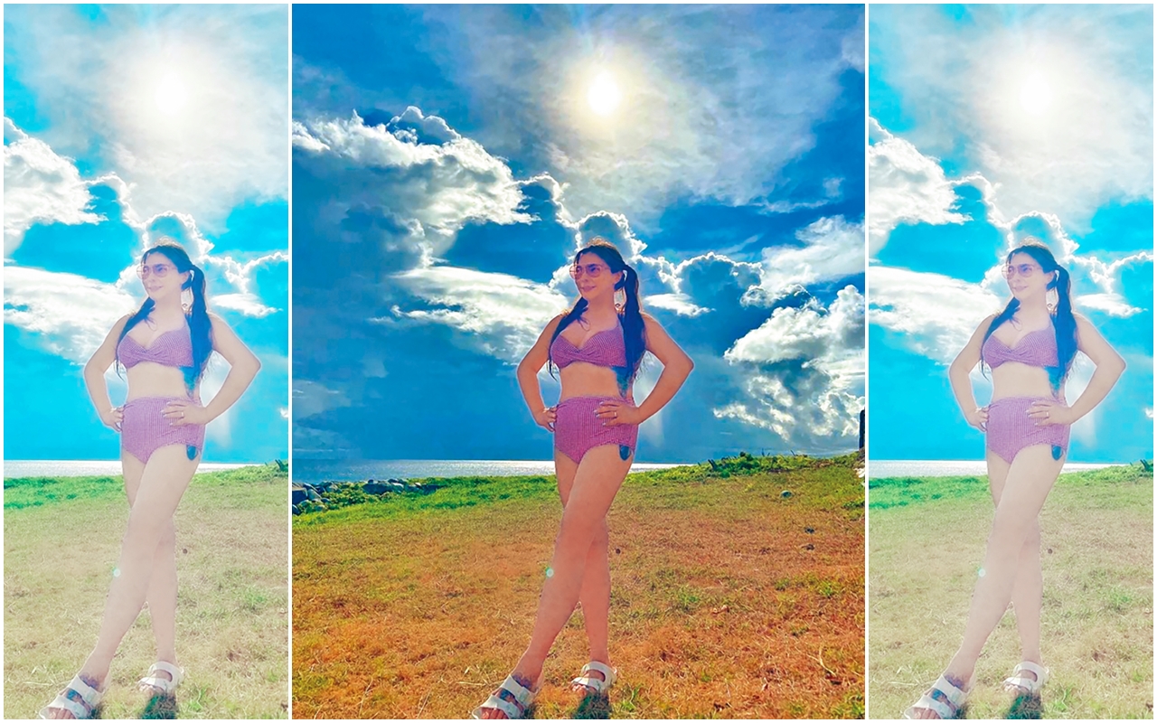 小甜甜到綠島狂曬比基尼照，網熱回：「太辣了！」她美腿交疊拉長、壓腳背，加上「腰痛」插腰，就有修長視覺效果。（翻攝自小甜甜張可昀臉書）