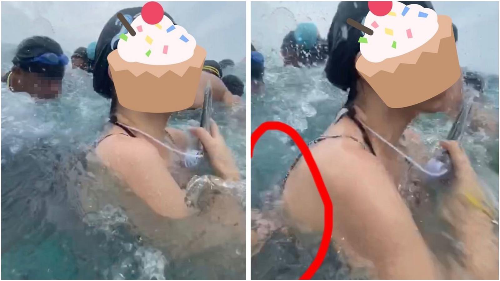 從女網友曝光的影片中，只見一名男子在浪拍打時疑似伸出鹹豬手。（翻攝自Dcard）