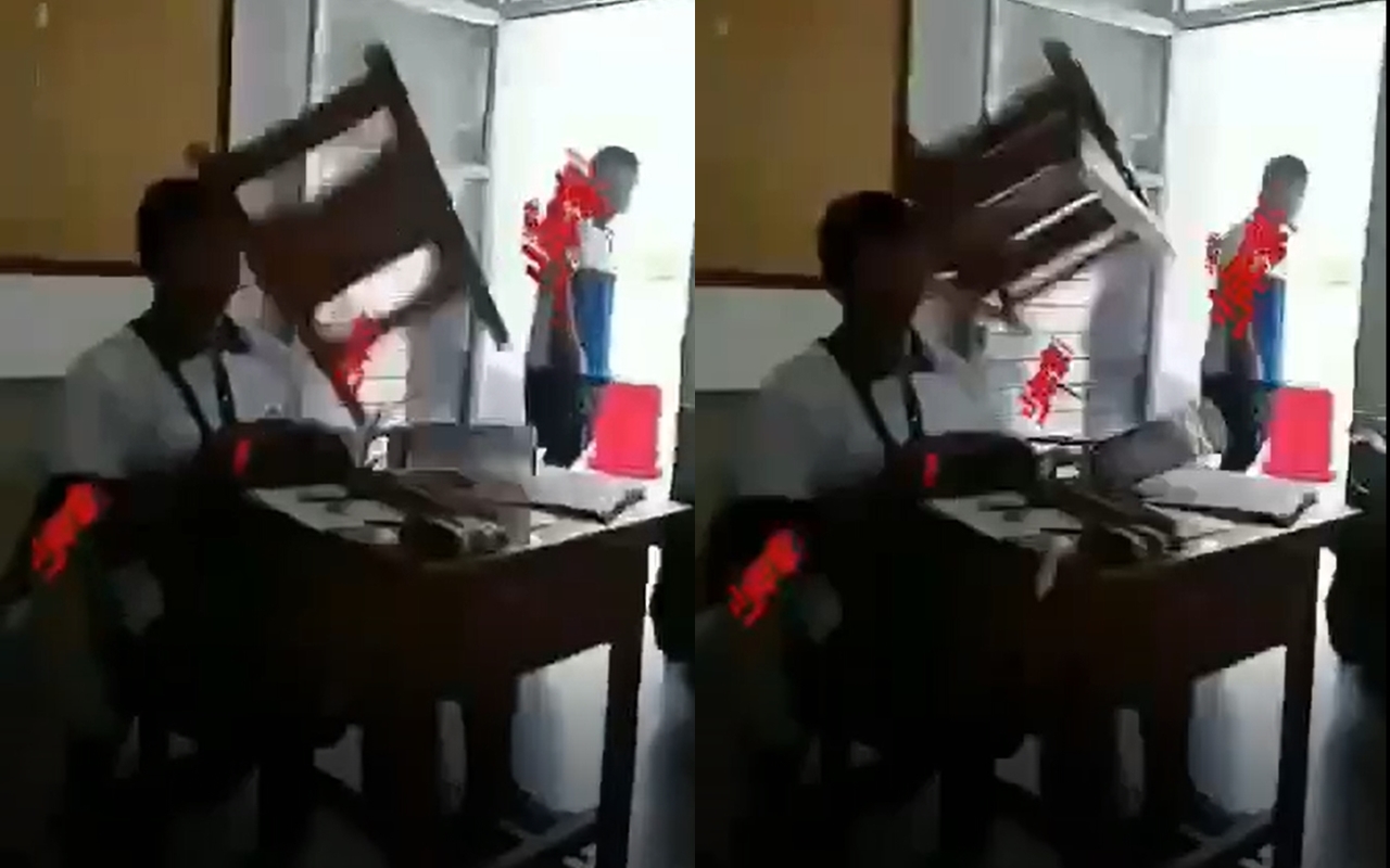 有人錄下游姓同學被木椅砸的畫面，影片還後製加上特效。（翻攝畫面）