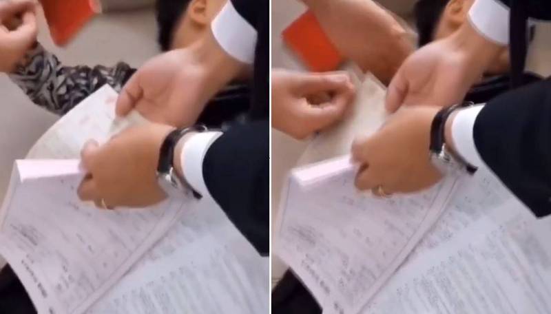 中國大陸一名阿公，在5歲金孫睡覺時以現金買房贈送，讓網友羨慕不已。（翻攝自中新視頻）