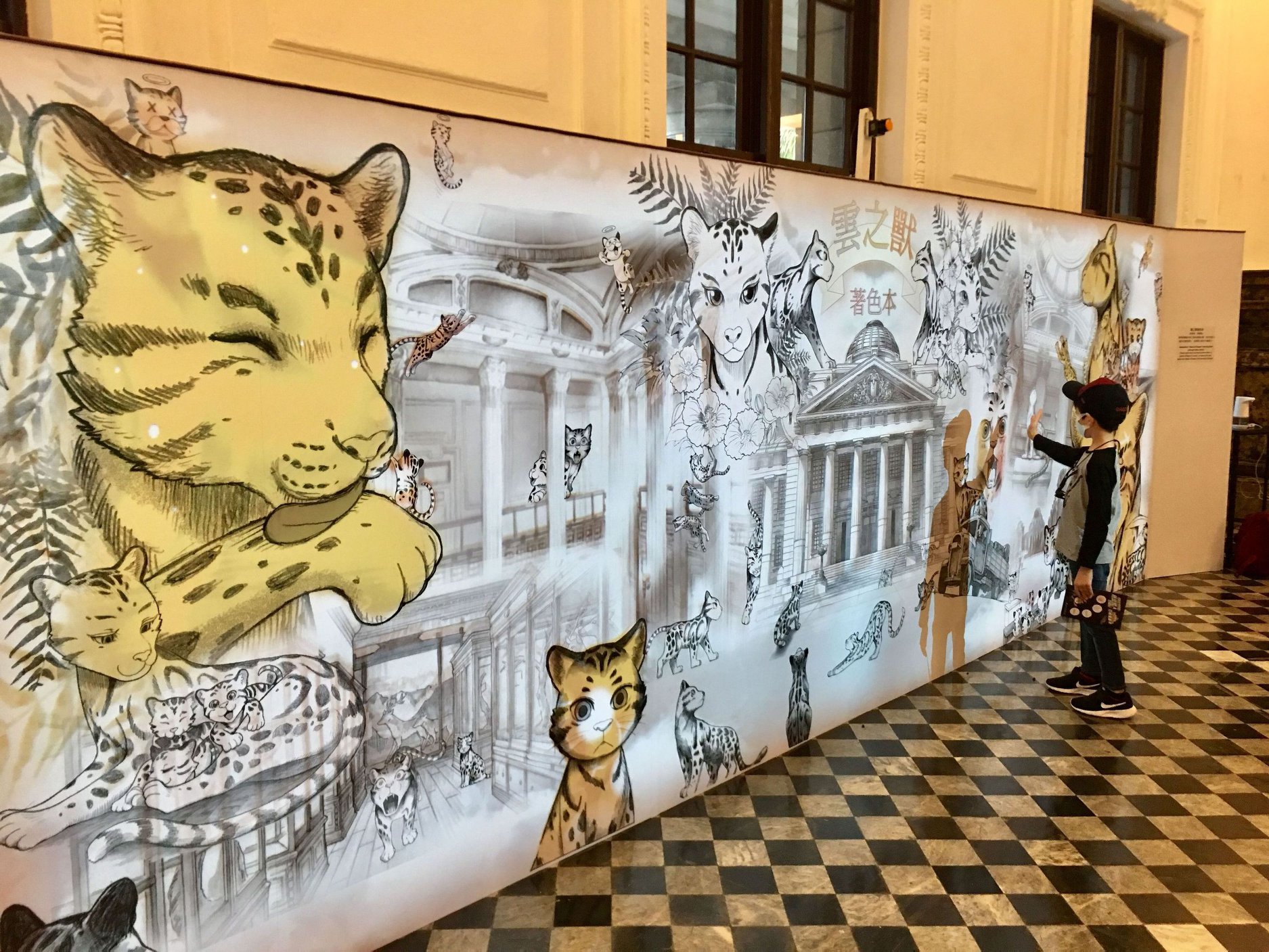 臺博館設置的《雲之獸》著色本互動裝置，用手觸摸就會有顏色變化，吸引小朋友駐足。（臺博館提供）