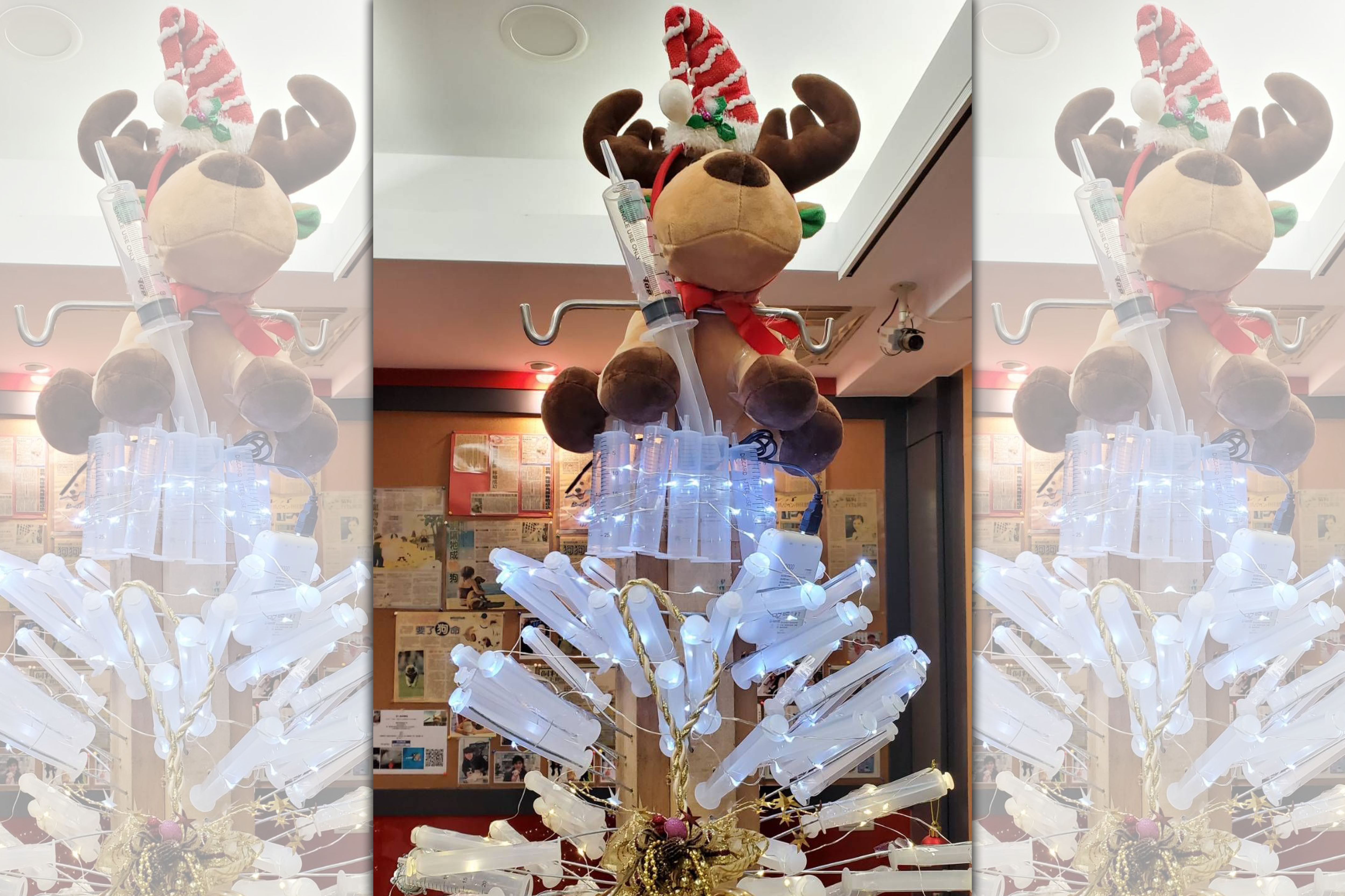 台北市信義區一家動物醫院，利用大量針筒、點滴架等耗材製作環保耶誕樹。（愛心動物醫院提供）