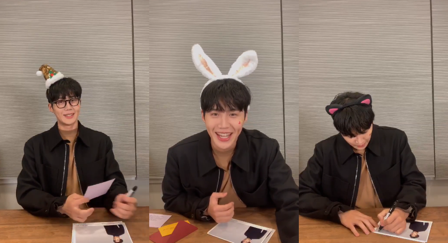 工作人員準備各種不同頭飾讓金宣虎配戴，他雖嘴上抱怨，仍配合完成。（翻攝自VLIVE畫面）