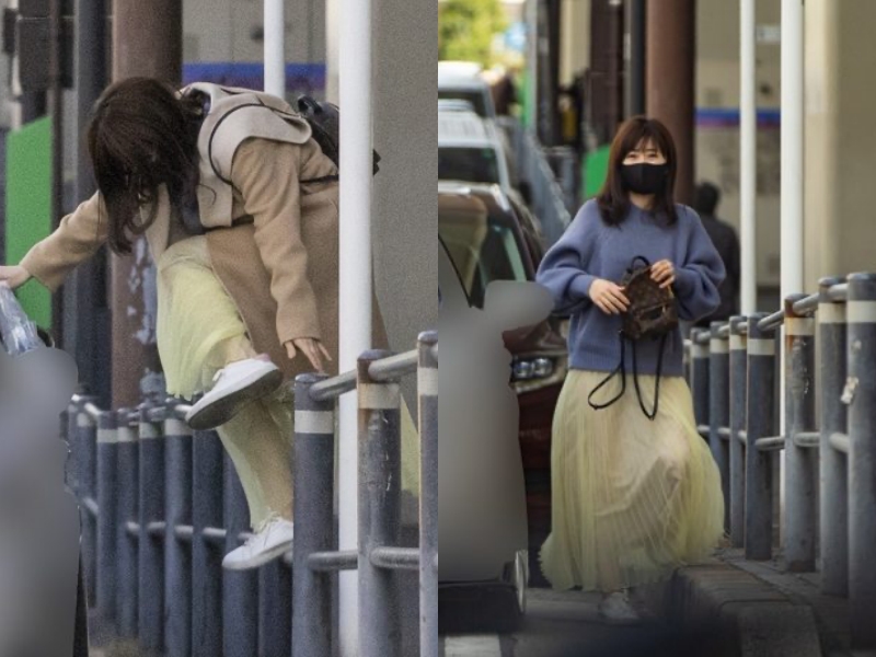 福原愛直接跨過半身高的欄杆,看起來相當急著上「高帥男」的車子。(翻攝自女性SEVEN網站)