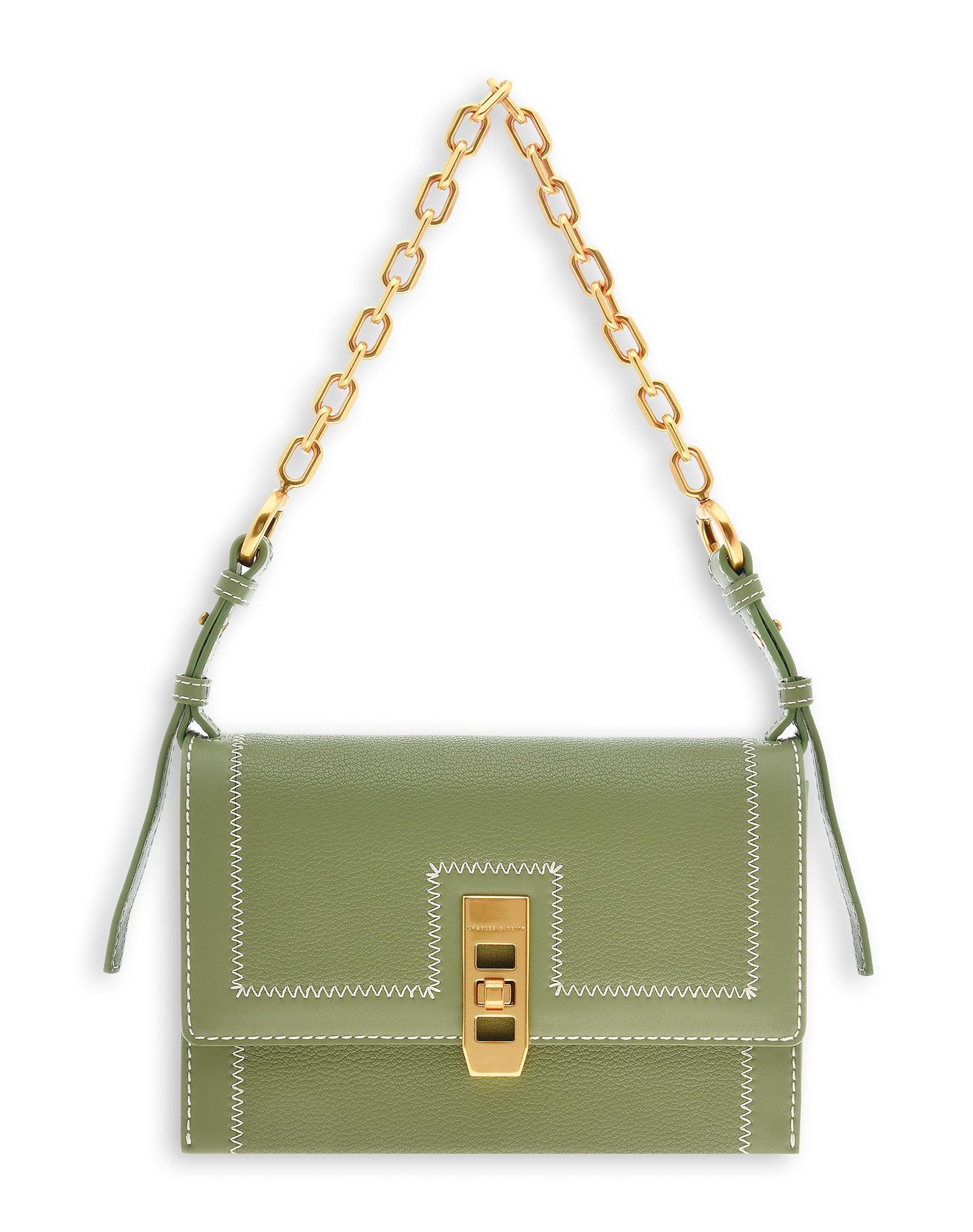 縫線轉釦手提包,NT$25,906。(CHARLES & KEITH提供)