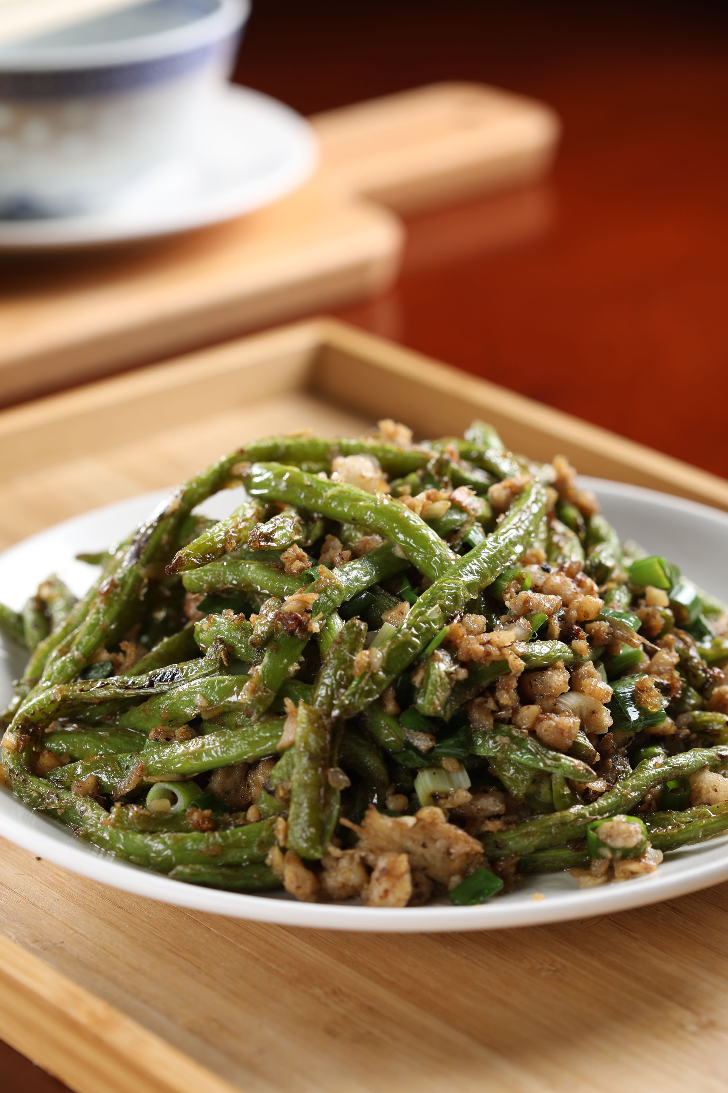 「乾煸四季豆」為了現代健康考量，煸得不如老菜焦，冬菜鮮味卻讓它相當耐吃。（260元／份）