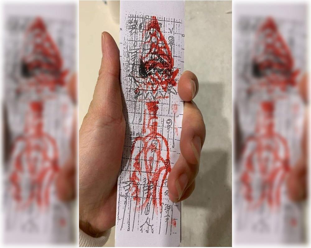家裡寄來一張詭異的符咒,疑似外籍保母對孩子下咒,讓原PO友人感到害怕,上網求助網友。(翻攝靈異公社)
