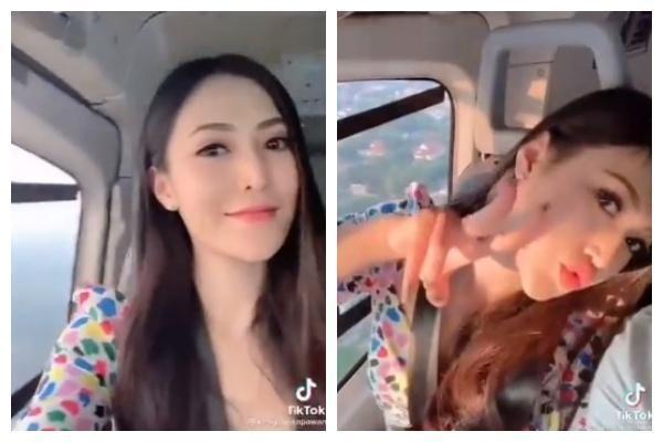 形貌美的妻子在機艙內對著鏡頭開心比YA及嘟嘴。（翻攝自Leopard_Sept的推特）