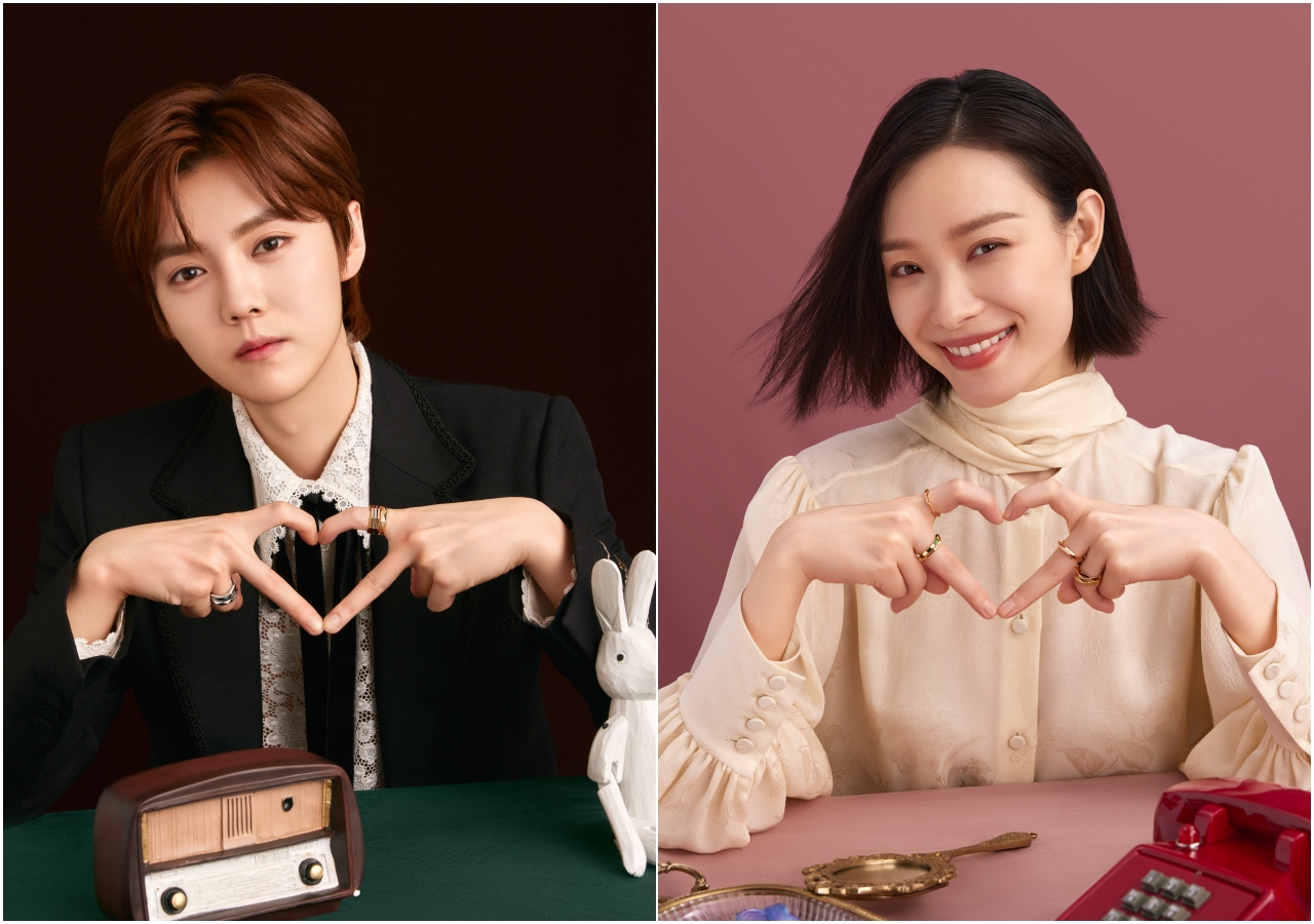 鹿晗（圖左）、倪妮手比愛心，傳達GUCCI Link to Love當代中性珠寶系列訴求的以人生、浪漫、相知相守無限輪回概念。（GUCCI提供）