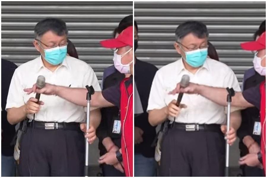 柯文哲被林昶佐嗆,正準備拿麥克風回應時,麥克風就秒被搶走。(翻攝疾管署Youtube)
