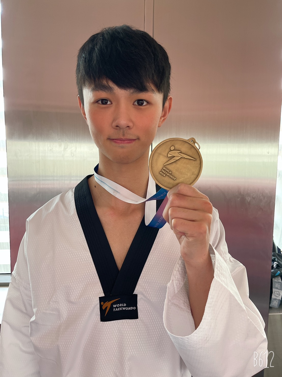 黃鈺仁在今年5月約旦舉辦的亞洲區資格賽，擊敗巴勒斯坦選手，取得奧運資格。（黃鈺仁提供）
