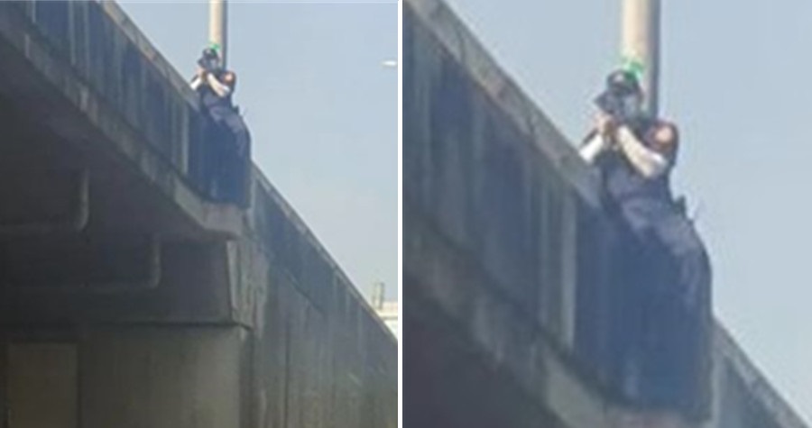 警爬到高架橋外「用生命抓超速」，引起網友熱議批評。（翻攝爆廢公社）