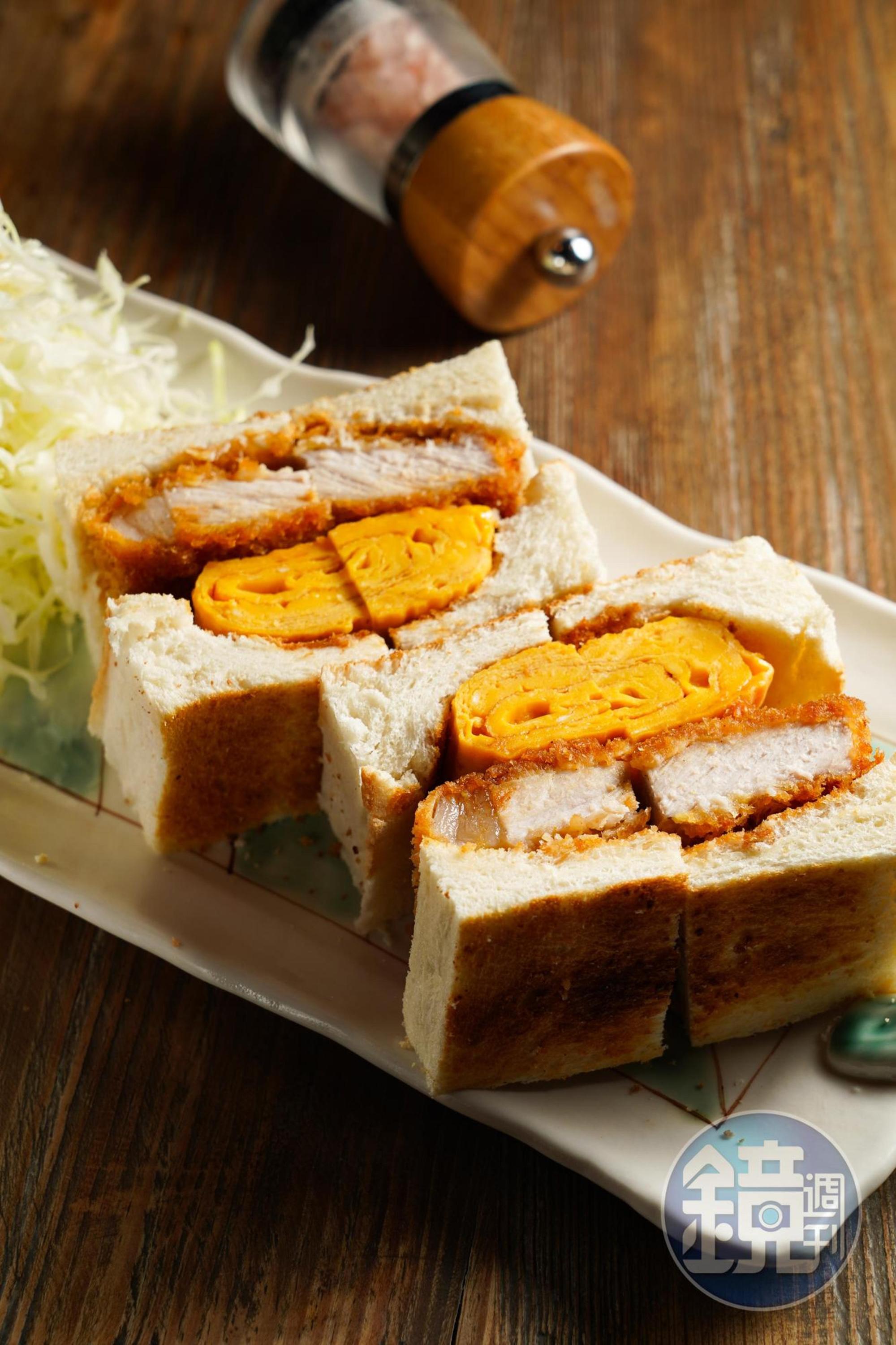 「炸豬排厚玉子三明治」麵衣中的特調香料帶咖哩香氣，配上葉黃素蛋煎成的厚玉子燒，鬆滑不噎人。（380元／份）