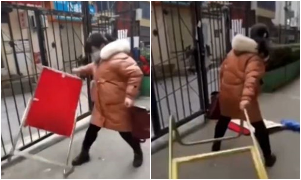 西安封城期間，有女子想闖出社區大門，與保安起衝突。（翻攝微博）