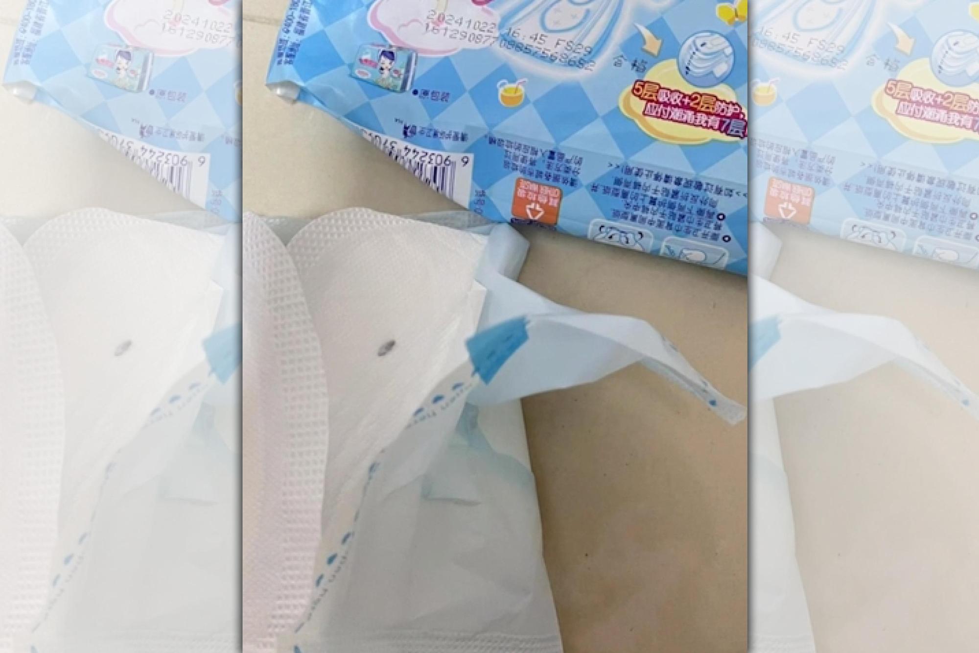 中國河北省一名女子投訴「七度空間」的衛生棉中夾了蟲卵。(翻攝澎湃新聞)