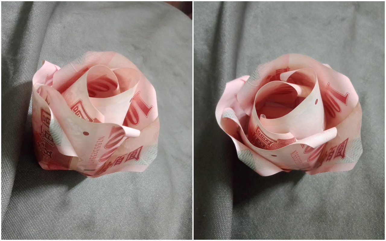 有名男網友準備了一萬元百元鈔票，打算親手摺出一束鈔票玫瑰送給愛妻。（翻攝自爆廢公社）