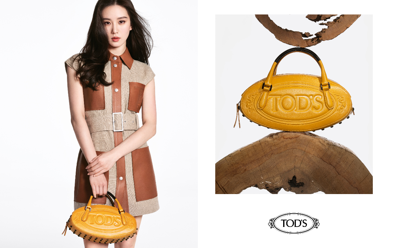 豆豆（Gommino）是TOD’S經典元素之一，劉詩詩手拿的豆豆包（NT$64,000）採用柔軟的皮革，底部有豆豆點綴。（TOD’S提供）