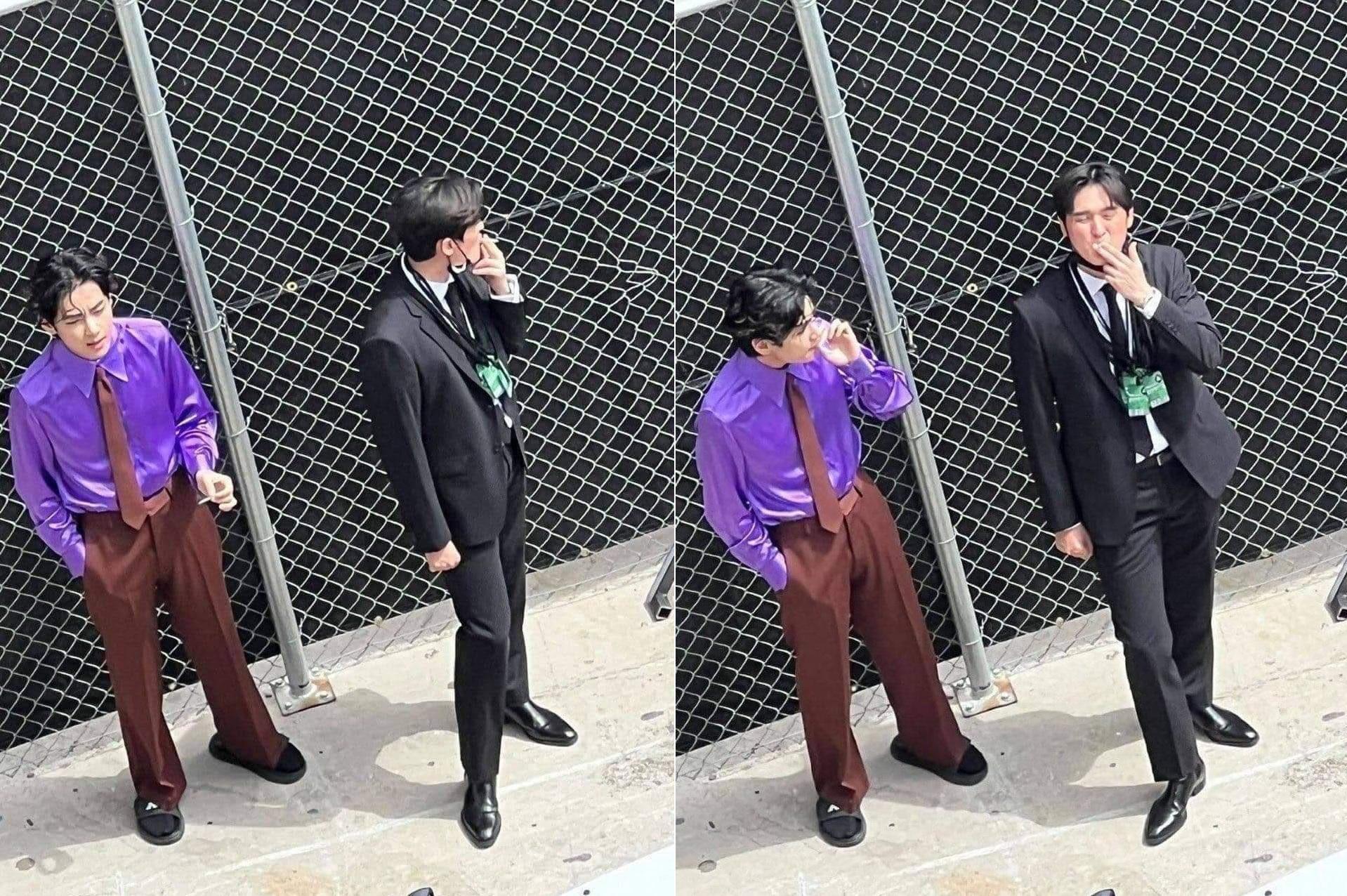 BTS成員V金泰亨被拍到和一名黑色西裝男子在葛萊美獎抽菸。(翻攝自推特)