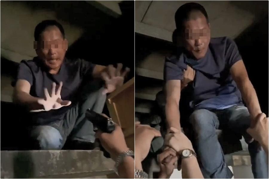 警方用槍比向李嫌，要他別輕舉妄動。（翻攝畫面）