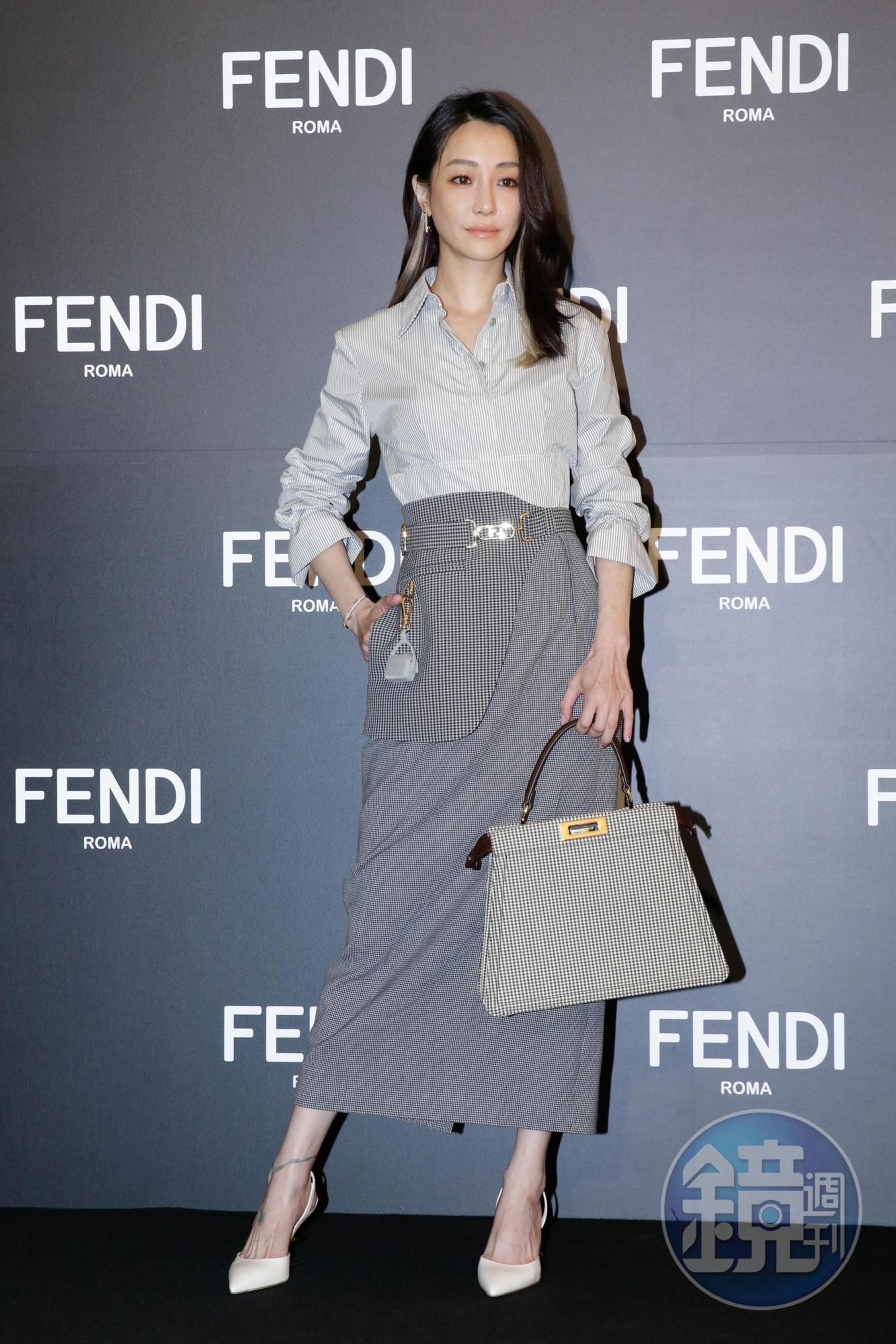 謝欣穎身著FENDI長袖襯衫,鉛筆裙上「偽馬甲」的結構讓她讚不絕口。
