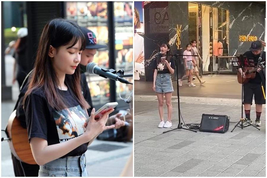 直播主「蛋捲」日前在信義區獻唱,吸引圍觀路人拍照錄影。(翻攝自蛋捲臉書、「爆廢公社二館」)
