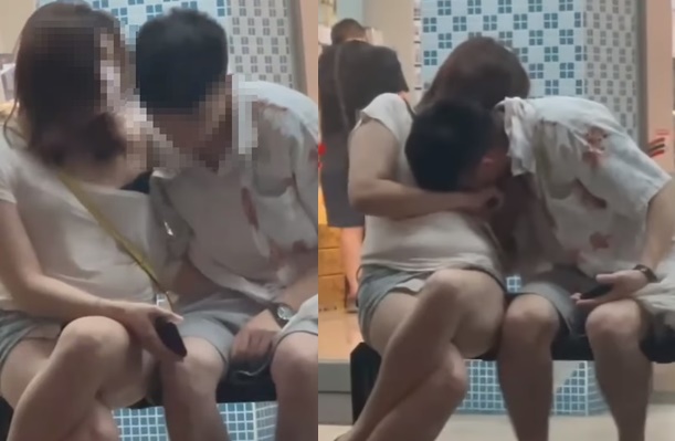 一情侶在街邊上演活春宮，女方手不安分，直接伸進男子褲擋，而男方則是直接拉下女子衣服，忘情舔奶。（翻攝自爆廢公社）